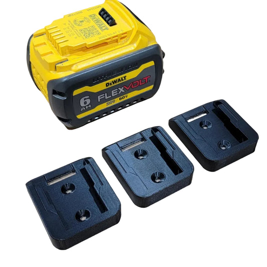 DeWalt battery and three black plastic brackets on a white background
